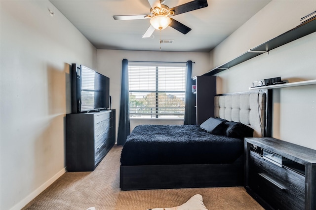 bedroom featuring ceiling fan and light colored carpet