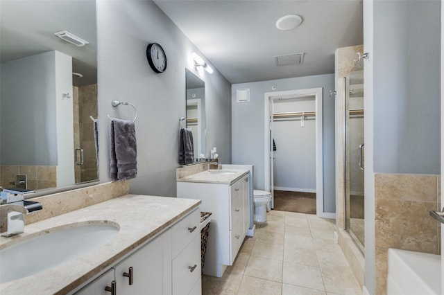 bathroom featuring vanity, tile patterned floors, and an enclosed shower