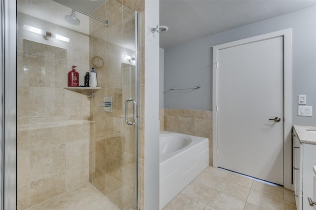 bathroom featuring tile patterned flooring, shower with separate bathtub, and vanity