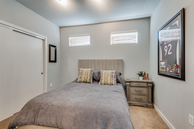 bedroom with light carpet