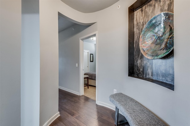 hall with dark hardwood / wood-style flooring