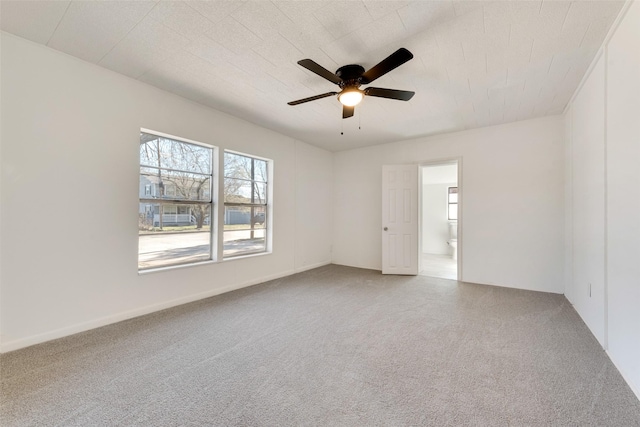 carpeted empty room with ceiling fan