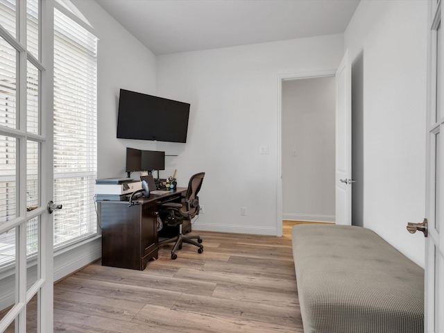 office area with light hardwood / wood-style floors