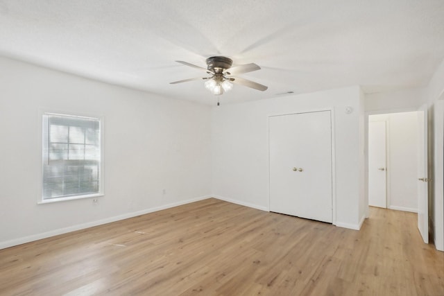 unfurnished bedroom featuring ceiling fan and light hardwood / wood-style flooring