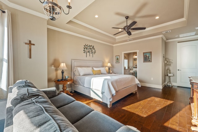 bedroom featuring a raised ceiling, dark hardwood / wood-style flooring, ceiling fan with notable chandelier, and crown molding