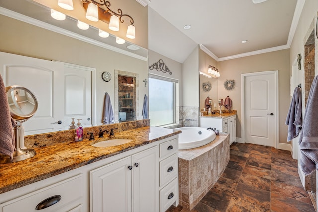 bathroom with ornamental molding, tiled tub, and vanity