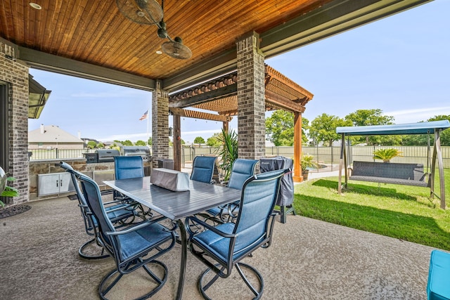 view of patio / terrace featuring ceiling fan