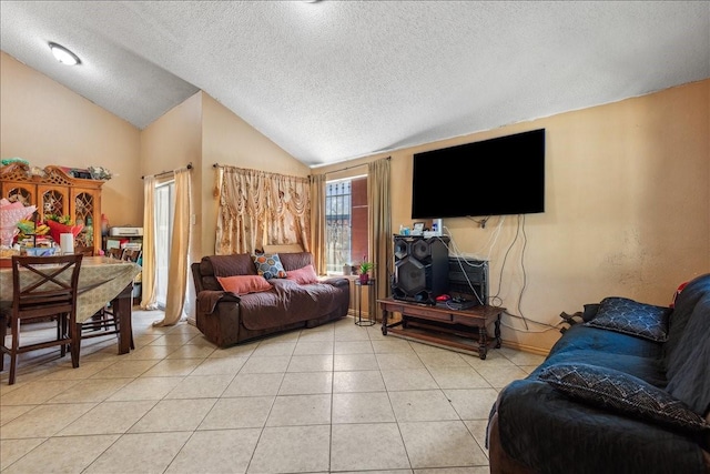 tiled living room featuring vaulted ceiling and a textured ceiling