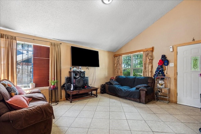 living room featuring a textured ceiling, light tile patterned flooring, and lofted ceiling