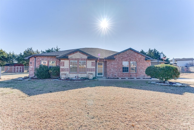 ranch-style house with a front lawn