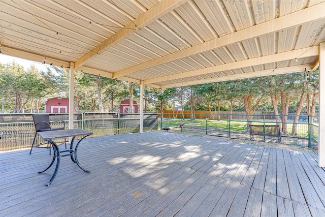 wooden deck featuring a shed