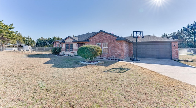 ranch-style home featuring a front lawn and a garage