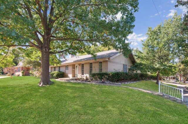 ranch-style home featuring a front yard