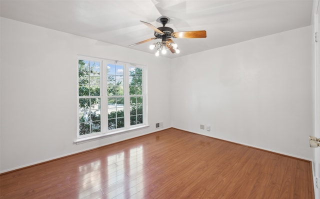 empty room featuring ceiling fan and light hardwood / wood-style floors