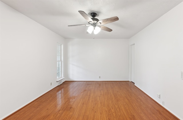 unfurnished room featuring wood-type flooring and ceiling fan