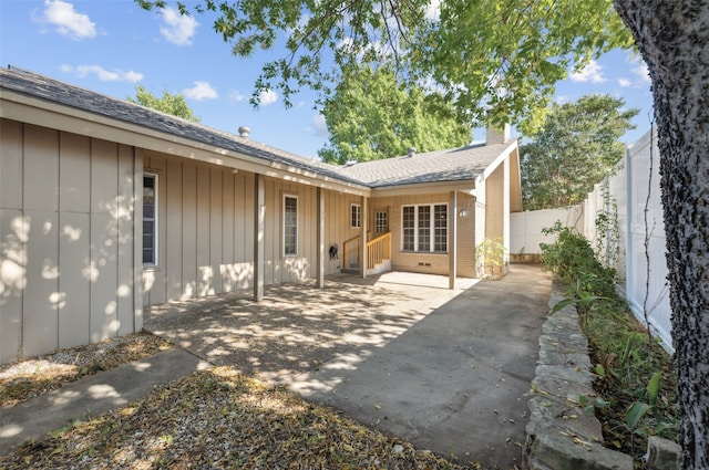 rear view of property featuring a patio