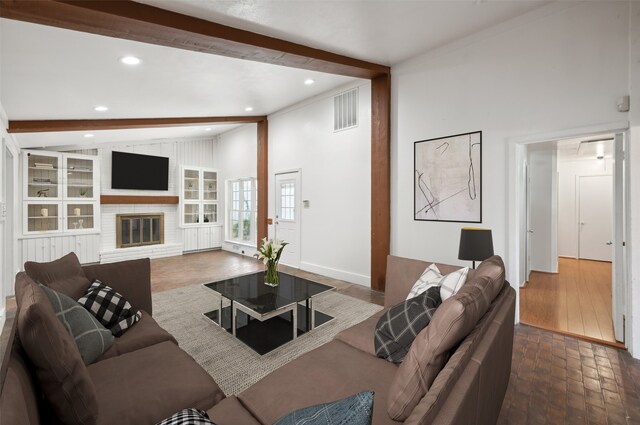 unfurnished room featuring plenty of natural light, crown molding, and hardwood / wood-style floors