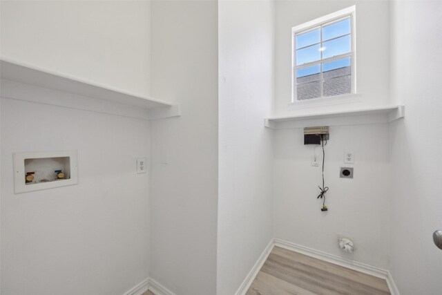 laundry room with electric dryer hookup, washer hookup, and light hardwood / wood-style flooring