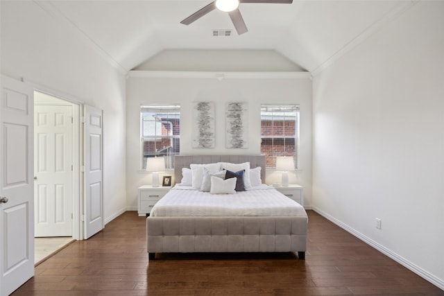 bedroom featuring dark wood-type flooring, ceiling fan, lofted ceiling, and ornamental molding