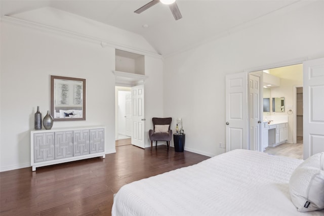 bedroom featuring crown molding, ensuite bath, vaulted ceiling, dark hardwood / wood-style flooring, and ceiling fan