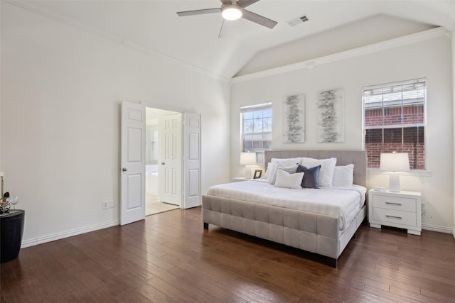 bedroom featuring vaulted ceiling, dark hardwood / wood-style floors, connected bathroom, ornamental molding, and ceiling fan