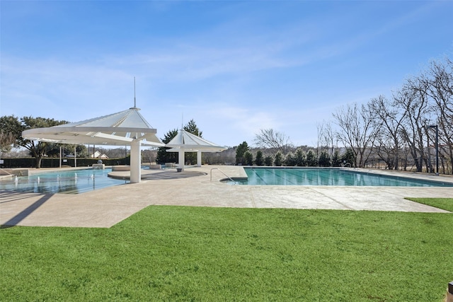 view of swimming pool featuring a gazebo, a lawn, and a patio