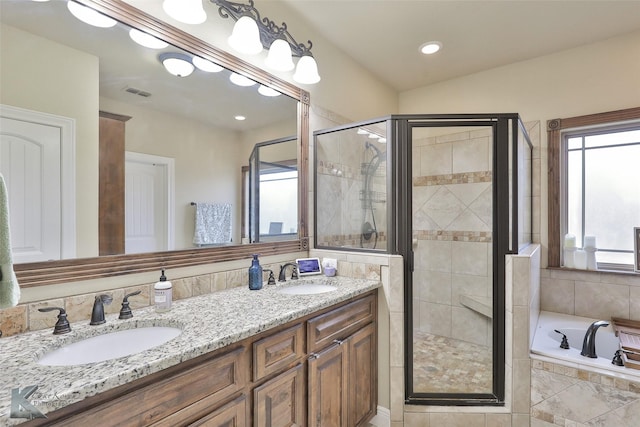 bathroom with vanity and plus walk in shower