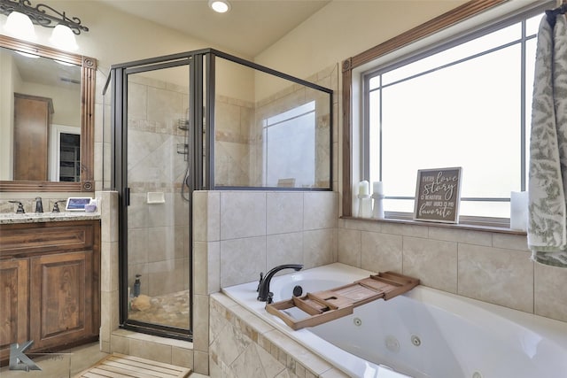 bathroom with separate shower and tub and vanity