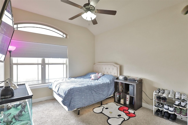 carpeted bedroom with ceiling fan and lofted ceiling