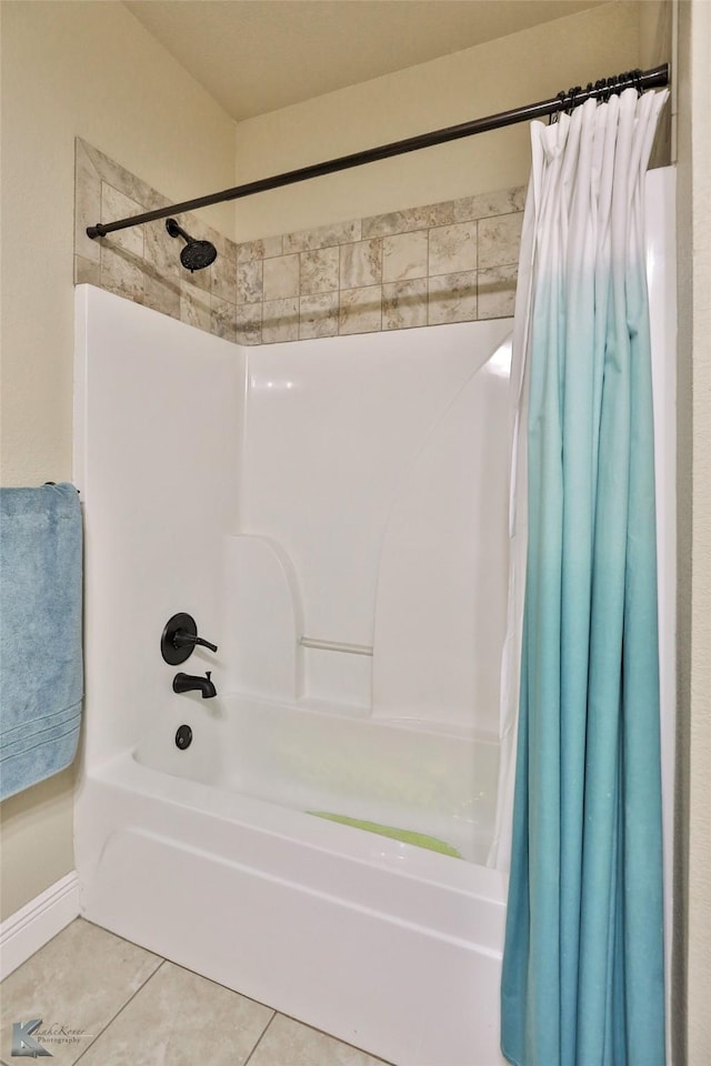 bathroom featuring shower / bath combo with shower curtain and tile patterned floors