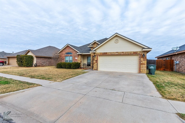 ranch-style house featuring a front yard and a garage