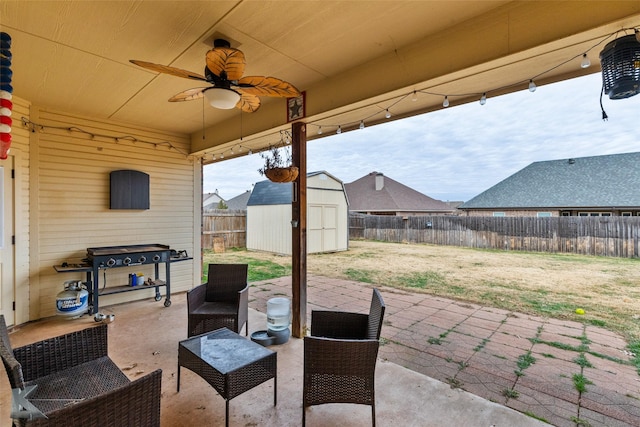 view of patio / terrace featuring ceiling fan and a storage unit