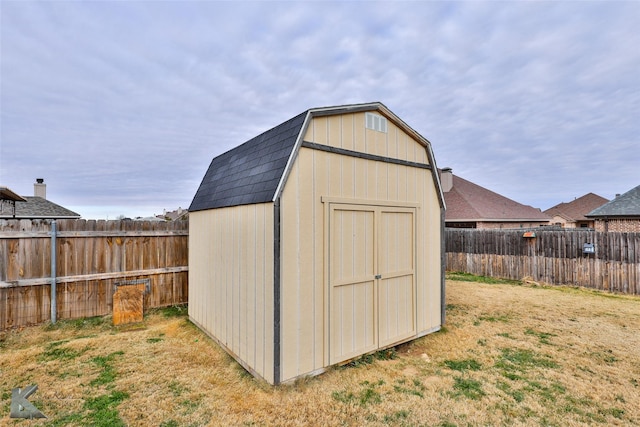 view of outbuilding featuring a yard