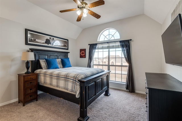 bedroom with ceiling fan, light colored carpet, and vaulted ceiling