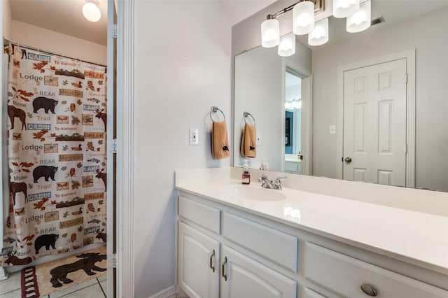 bathroom featuring vanity, a shower with curtain, and tile patterned flooring