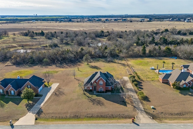 birds eye view of property featuring a rural view