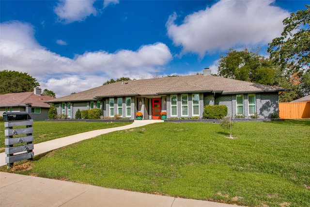 single story home featuring a front yard