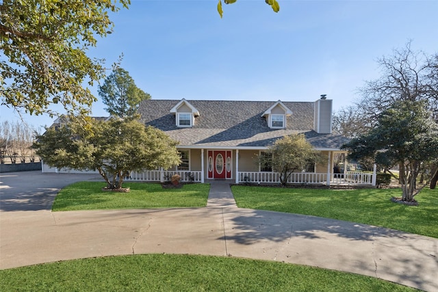 cape cod home featuring covered porch and a front yard