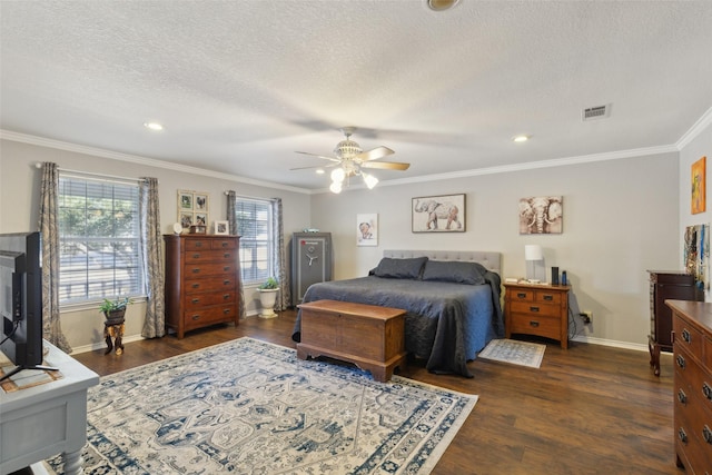 bedroom featuring ceiling fan, crown molding, dark wood-type flooring, and a textured ceiling