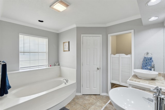 bathroom featuring a bath, crown molding, vanity, and tile patterned flooring