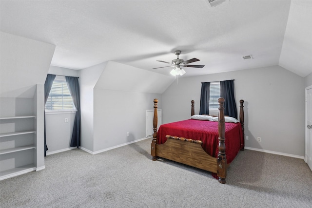 carpeted bedroom with ceiling fan and lofted ceiling