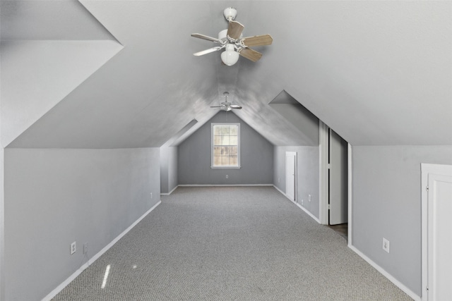 bonus room featuring ceiling fan, light carpet, and lofted ceiling