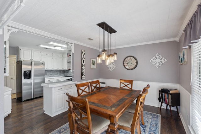 dining space with crown molding and dark wood-type flooring