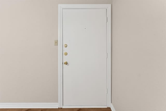 doorway to outside featuring hardwood / wood-style flooring