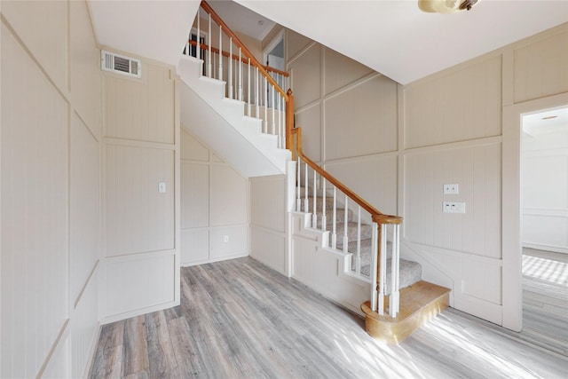 stairway featuring hardwood / wood-style flooring