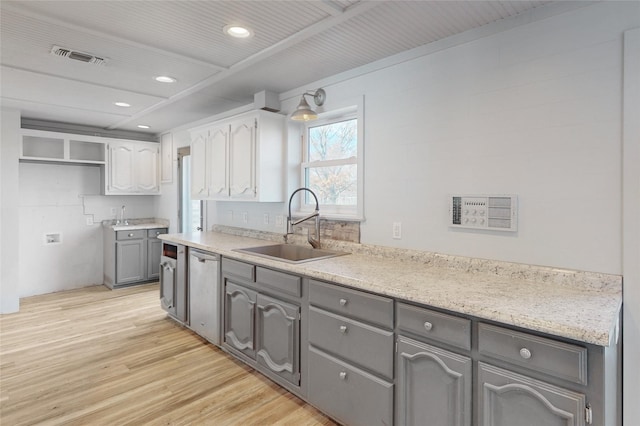 kitchen with dishwasher, white cabinetry, light hardwood / wood-style floors, sink, and gray cabinets