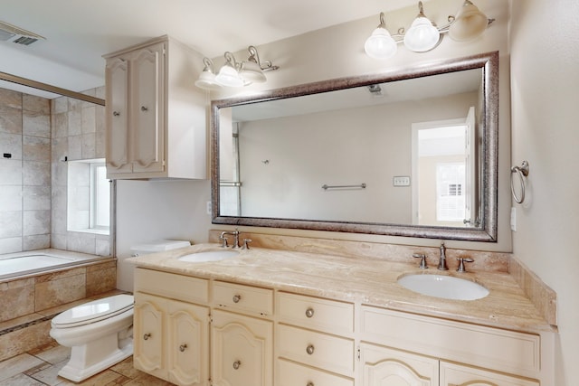 bathroom with toilet and vanity