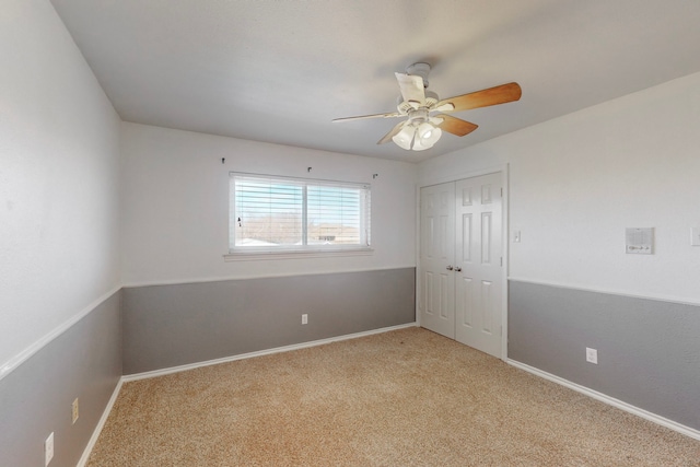 unfurnished room with light carpet and ceiling fan