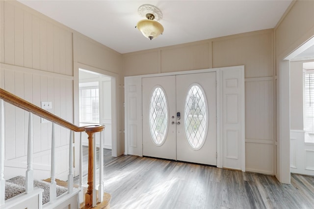 entryway featuring french doors and light hardwood / wood-style flooring