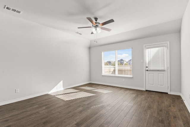 unfurnished room with ceiling fan and dark hardwood / wood-style flooring